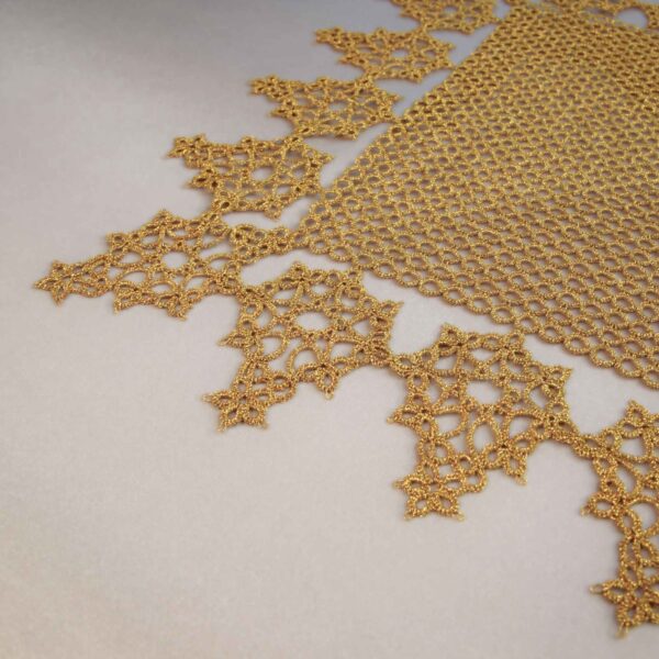 free tatting doily pattern corner close-up showing leaf edging gold on cream satin